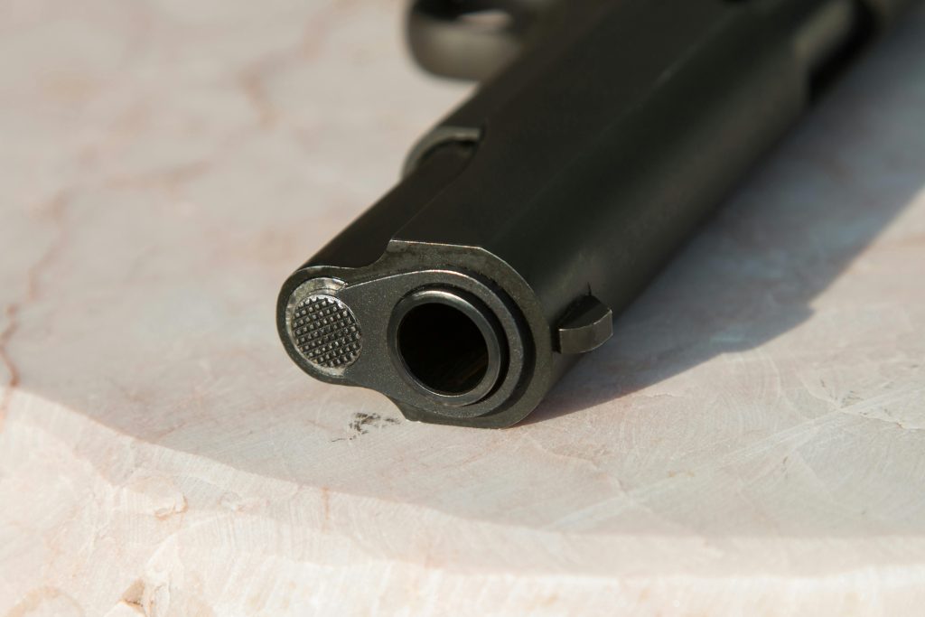 a black gun with a barrel