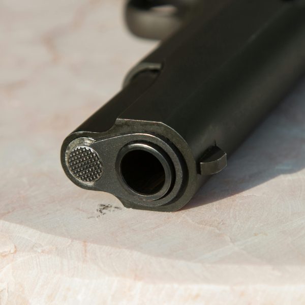 a black gun with a barrel